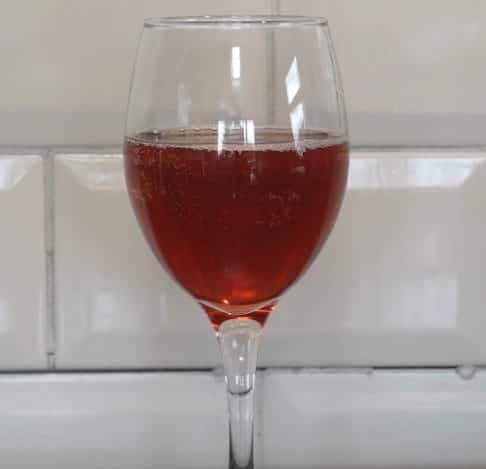 A glass of  beetroot wine