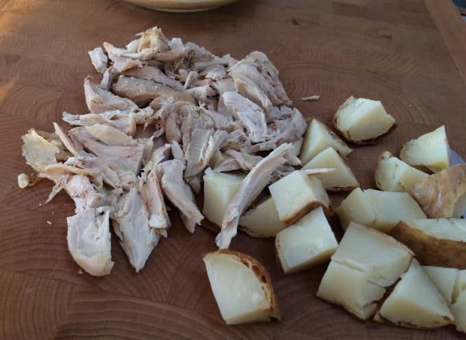 Chopping cooked chicken and potatoes