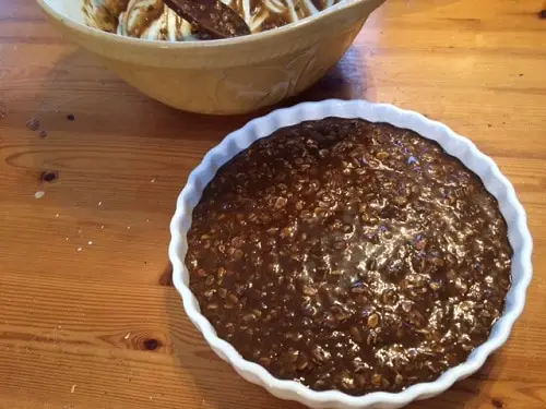 Cake ingredients in a flan dish ready to cook.